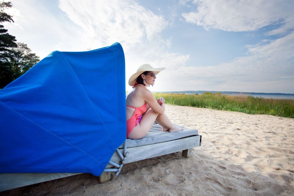Woman in beach cabana